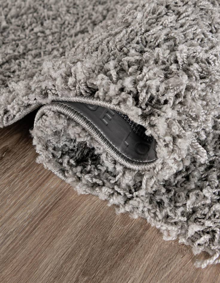 Detail image of  2' 2 x 3' 7 Solid Shag Hearth Rug