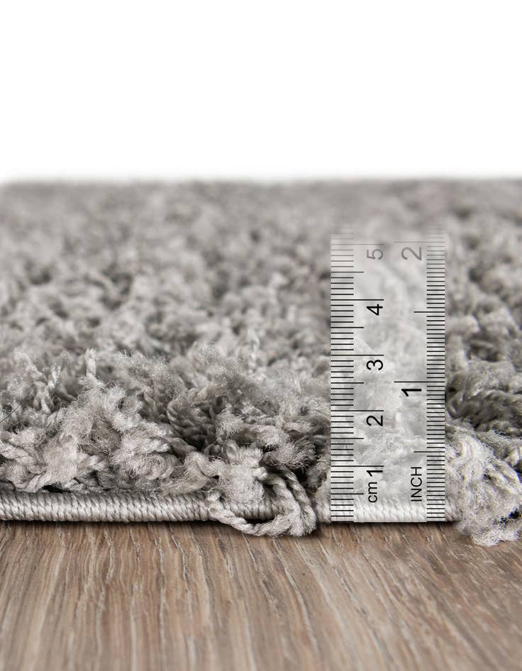 Detail image of  2' 2 x 3' 7 Solid Shag Hearth Rug