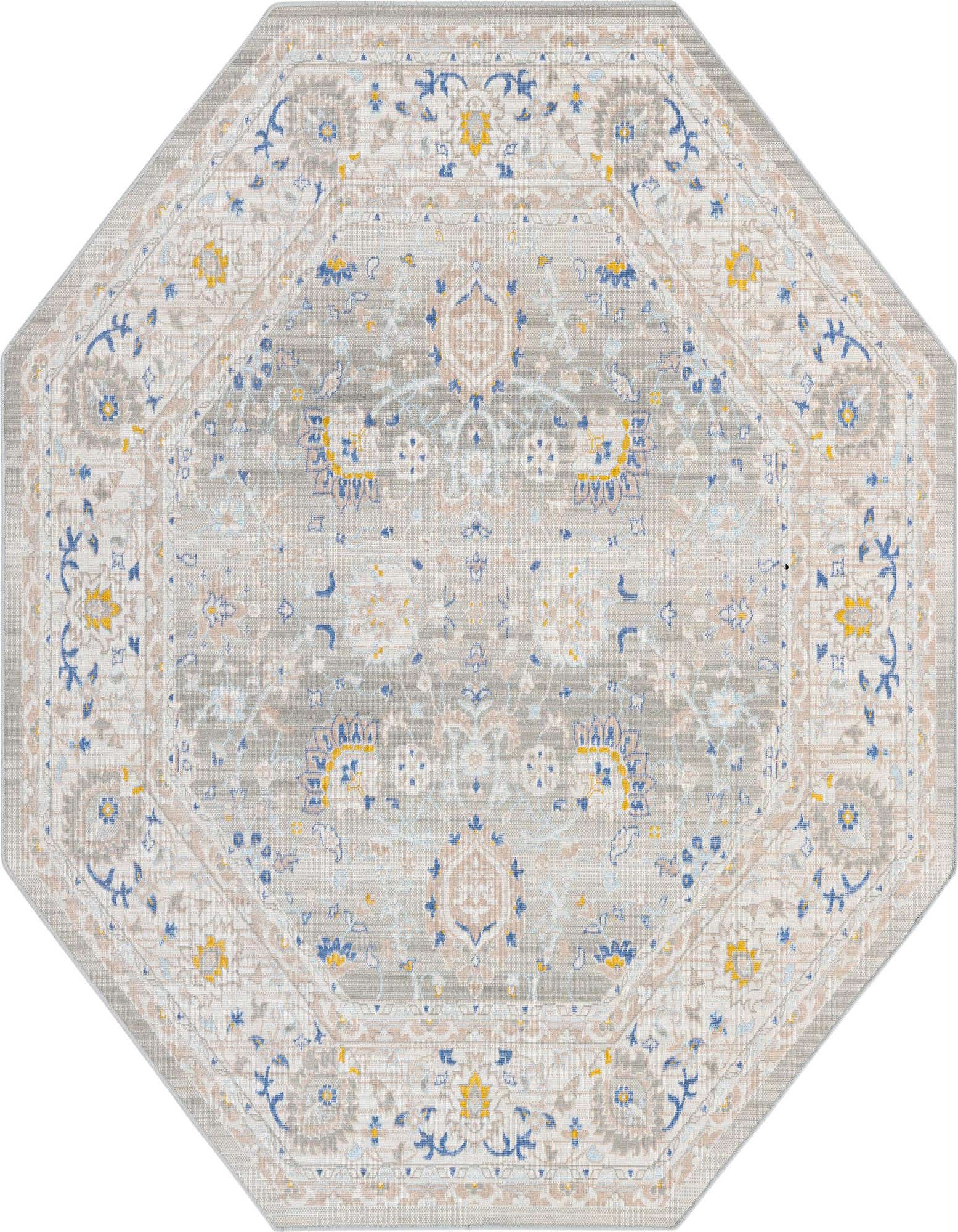 An octagon-shaped gray flatweave rug with a traditional botanical pattern in muted blues, yellows, and creams.
