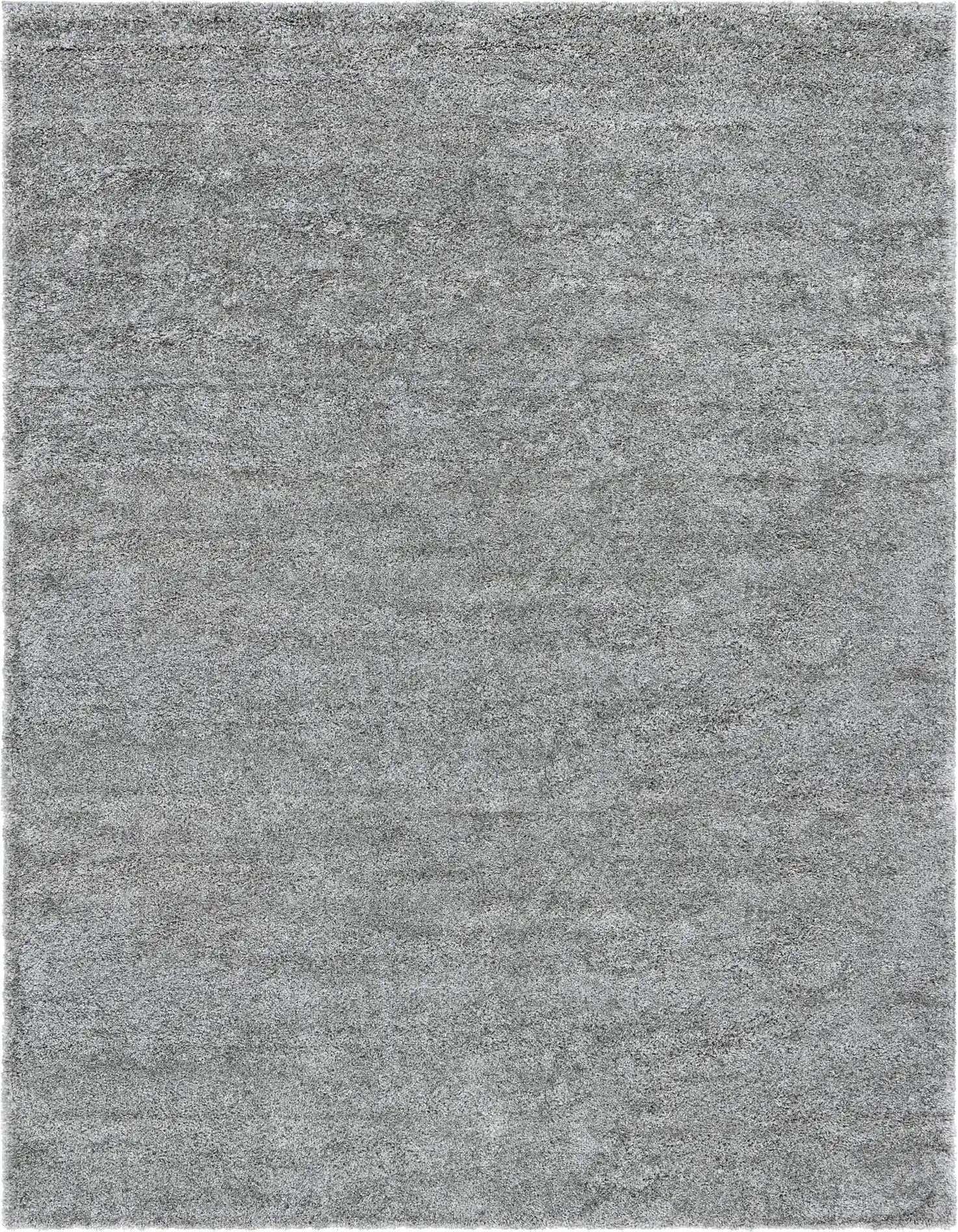 A soft, rectangular 8x11 gray shag area rug with a textured pile, perfect for a modern living room.