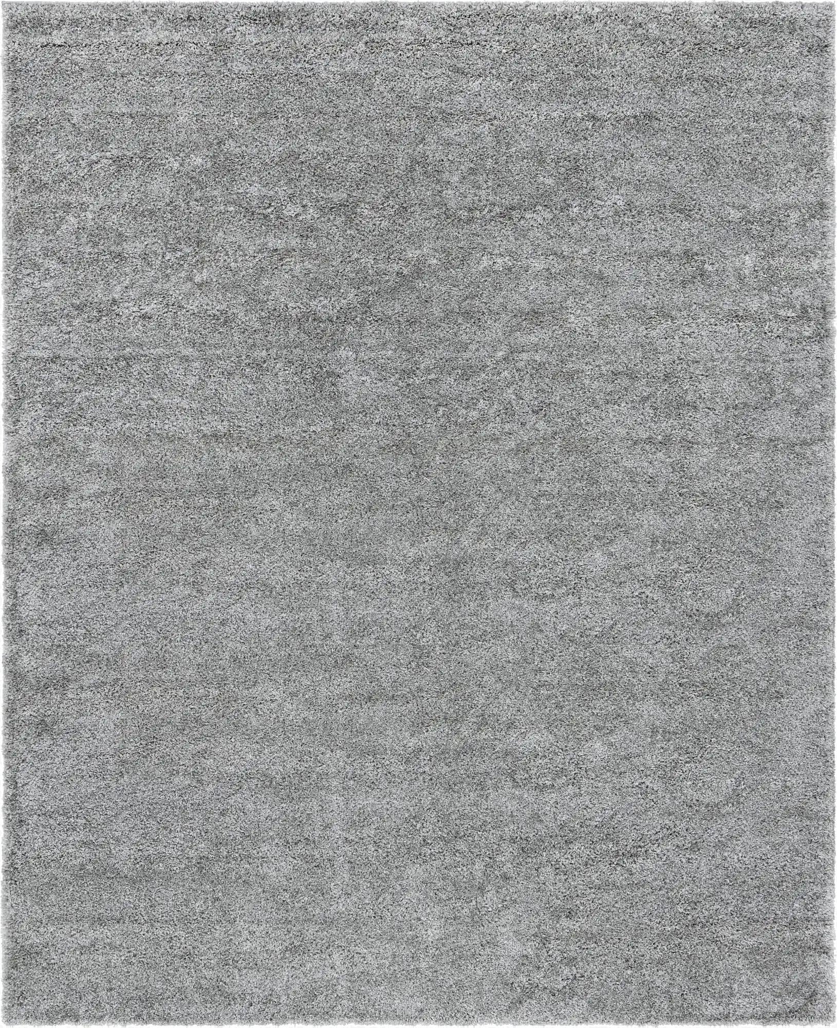 A soft, rectangular 8x10 gray shag rug with a textured pile, ideal for a modern living room or bedroom.