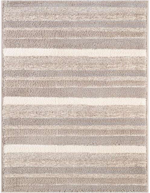 A close-up of an 8 ft runner rug from the Rugs.com Sepia collection, featuring textured horizontal stripes in varying shades of gray and silver.