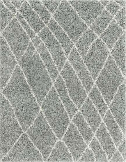 A soft gray shag runner rug with a subtle white diamond pattern, perfect for a modern hallway.