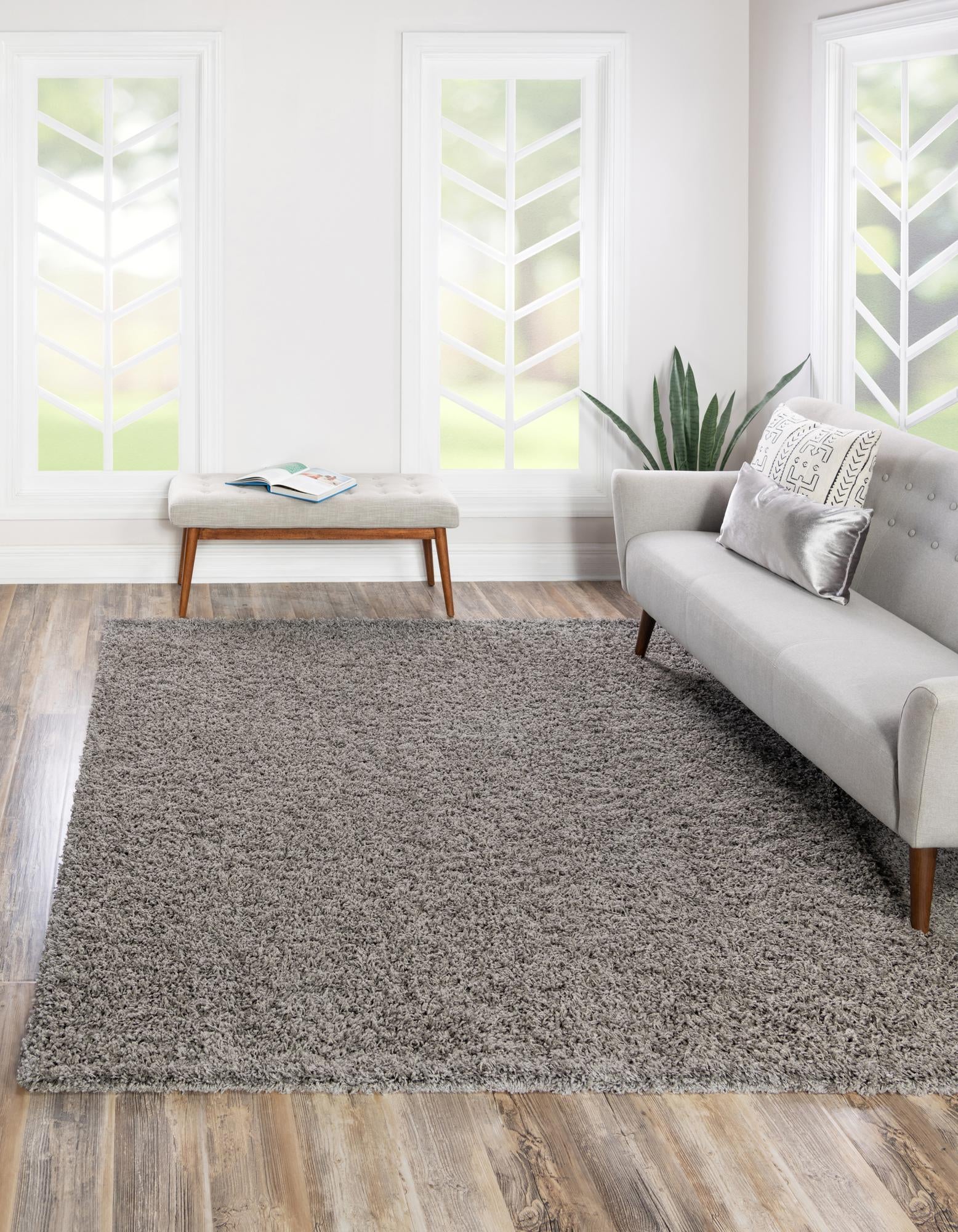 A 3'x3' square gray shag rug with a thick, textured pile, perfect for adding comfort to any indoor space.