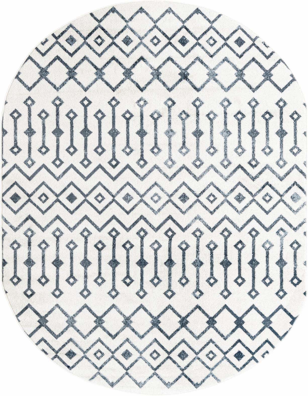 An oval rug featuring a distressed blue tribal trellis pattern on an ivory background, suitable for a living room.