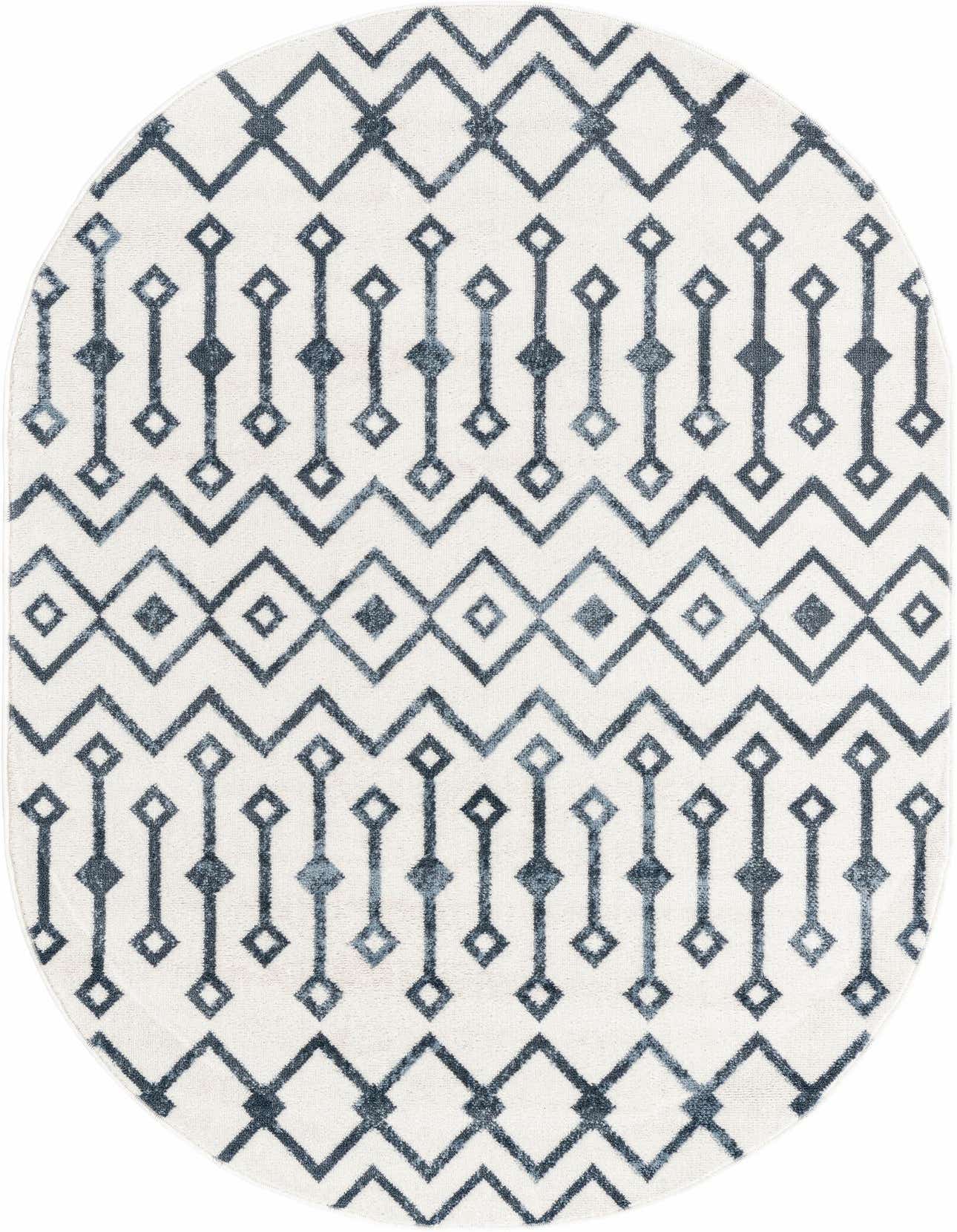 An oval 4' x 6' rug featuring a cream background with a repeating blue tribal trellis pattern, ideal for an indoor space.