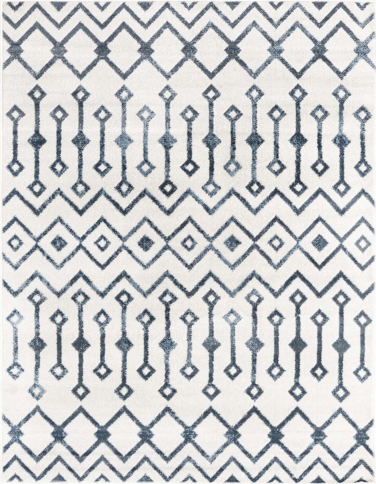 A 4x6 rectangular indoor rug with a white background and a distressed blue tribal trellis pattern.