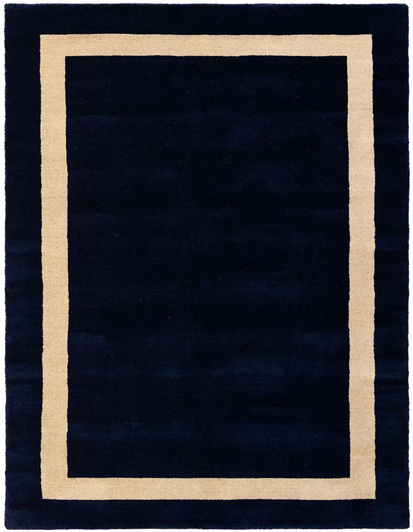 A 4x6 rectangular Jill Zarin Border Wool rug in deep cobalt blue with a clean, light beige border, perfect for modern living spaces.