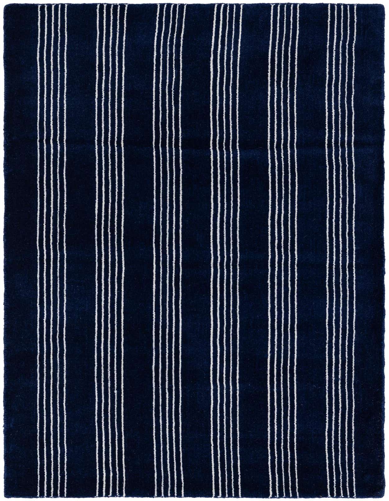 A 3x5 rectangular Jill Zarin Striped Wool rug in cobalt blue with thin white vertical stripes.