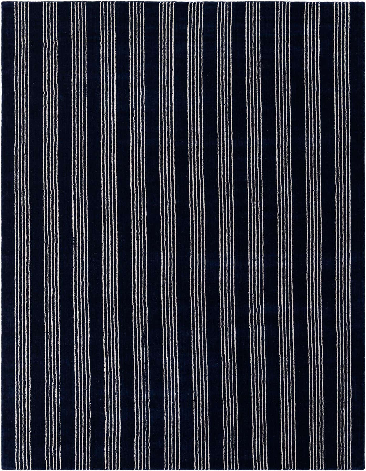 A 6x9 rectangular Jill Zarin Striped Wool rug in cobalt blue with thin white vertical stripes, suitable for a living room.