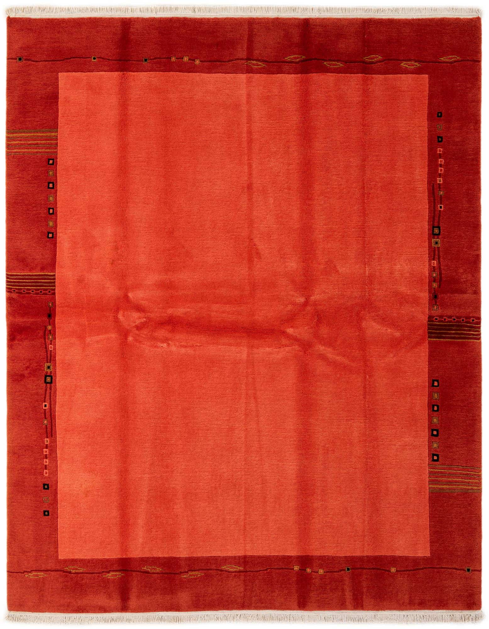 A 6x9 rectangular modern wool rug featuring a vibrant orange center field bordered by a darker reddish-orange with subtle abstract patterns.