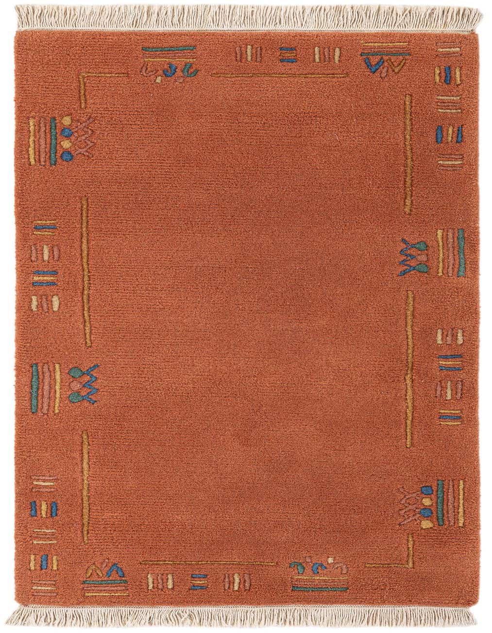A rectangular 3x5 orange wool rug with a modern abstract border pattern in blue, green, and gold, featuring white fringe.