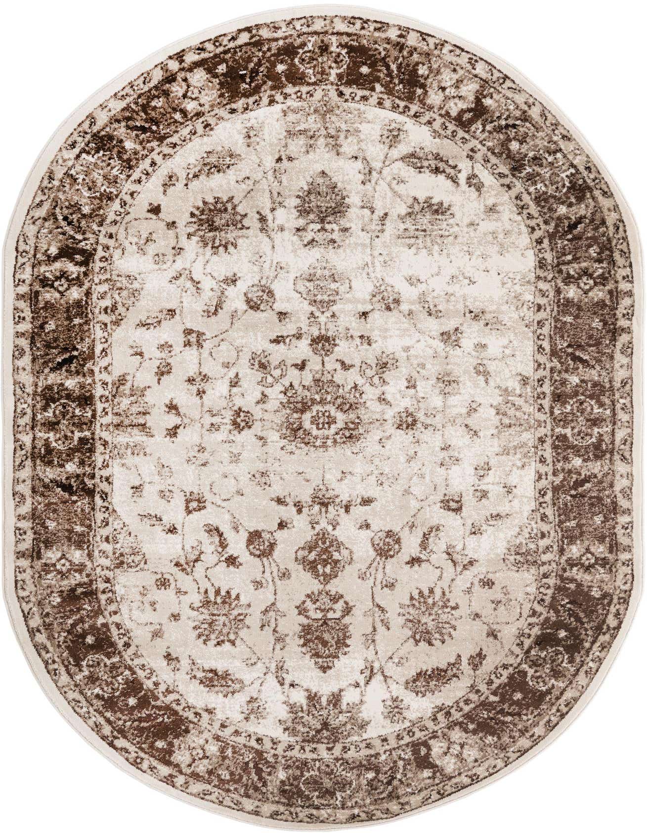 An oval 5' 3 x 8' 0 ivory and brown traditional area rug with an ornate floral pattern and dark border.