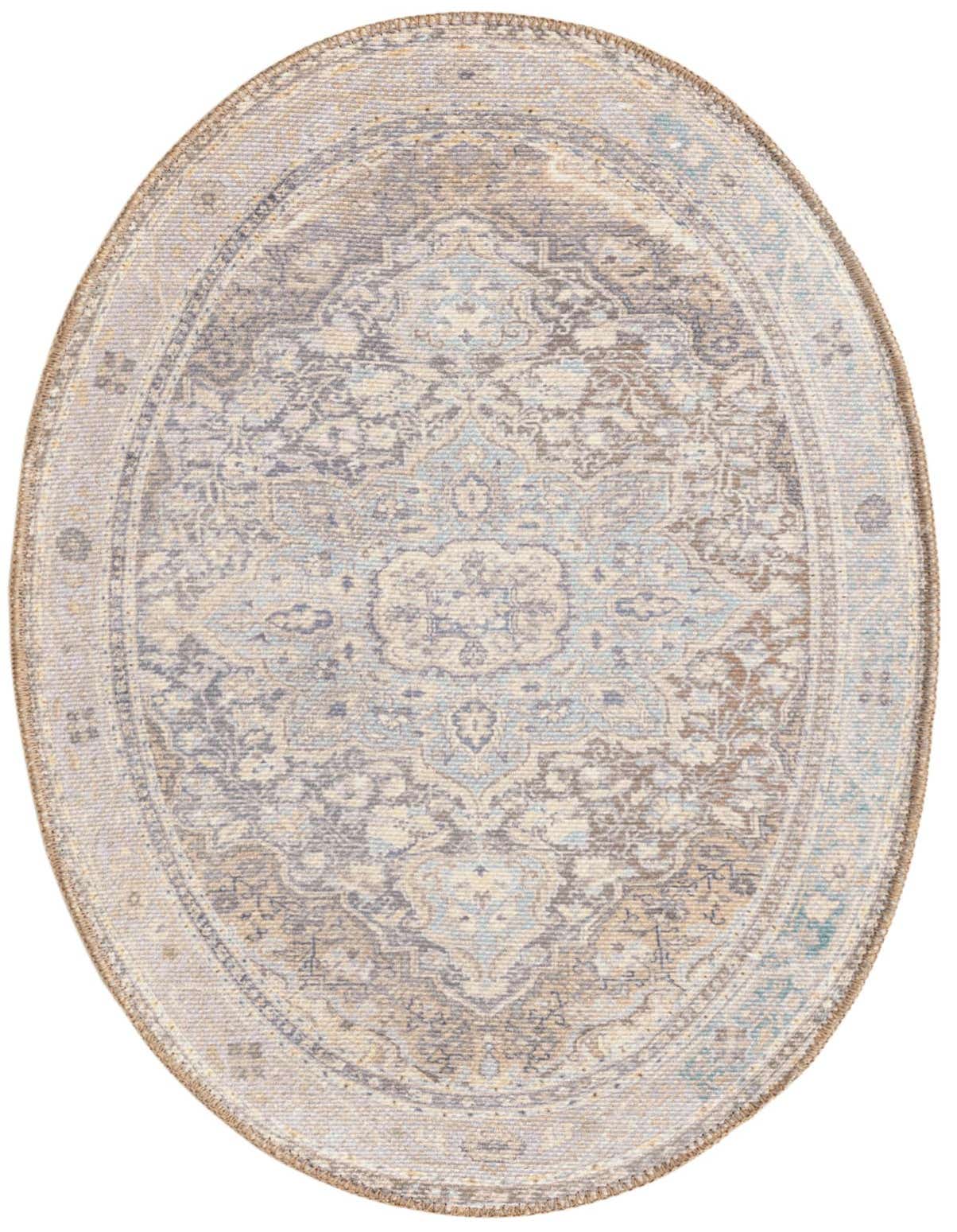 An oval 2'x3' ivory and cream flatweave rug with a subtle transitional medallion and tribal pattern.