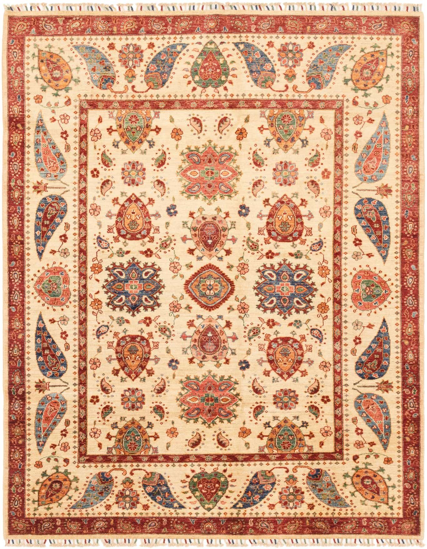 A 6x9 rectangular Ariana Ziegler rug featuring a cream field with intricate traditional patterns in red, blue, green, and orange, framed by a wide red border.