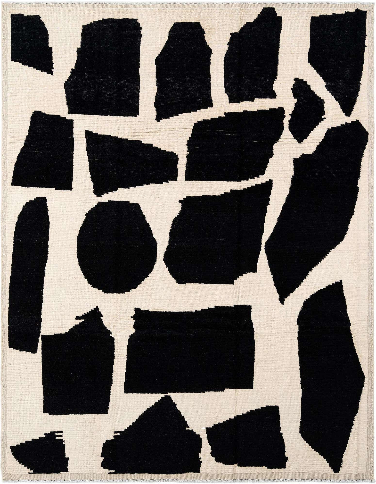 A rectangular Beni Marok rug with a cream background and abstract black shapes, showcasing its handmade wool texture.