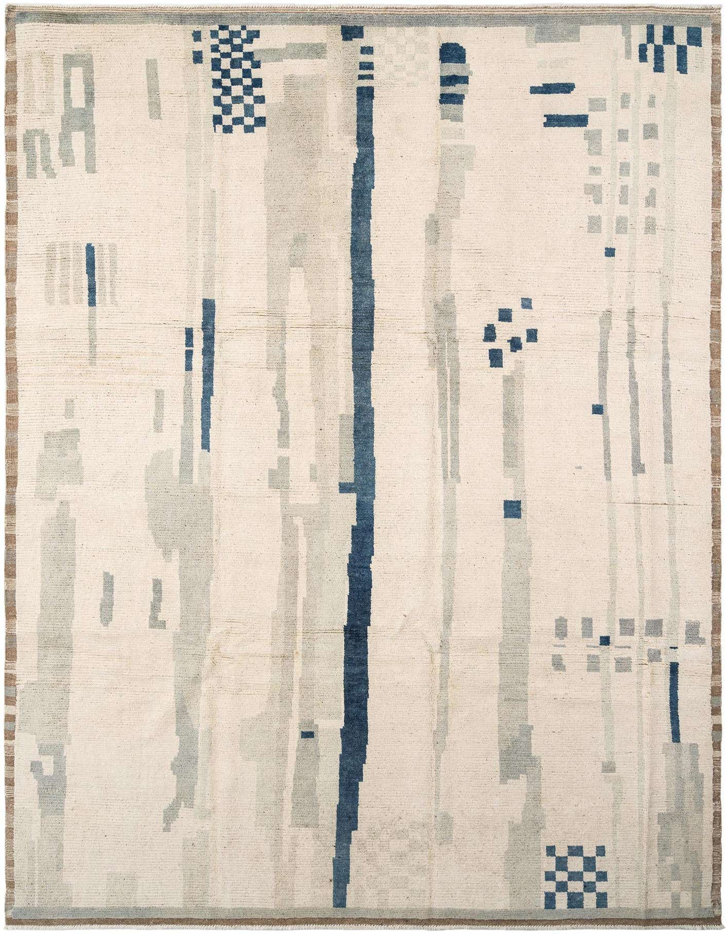 A handmade rectangular Beni Marok rug featuring an ivory background with abstract blue and gray geometric patterns.