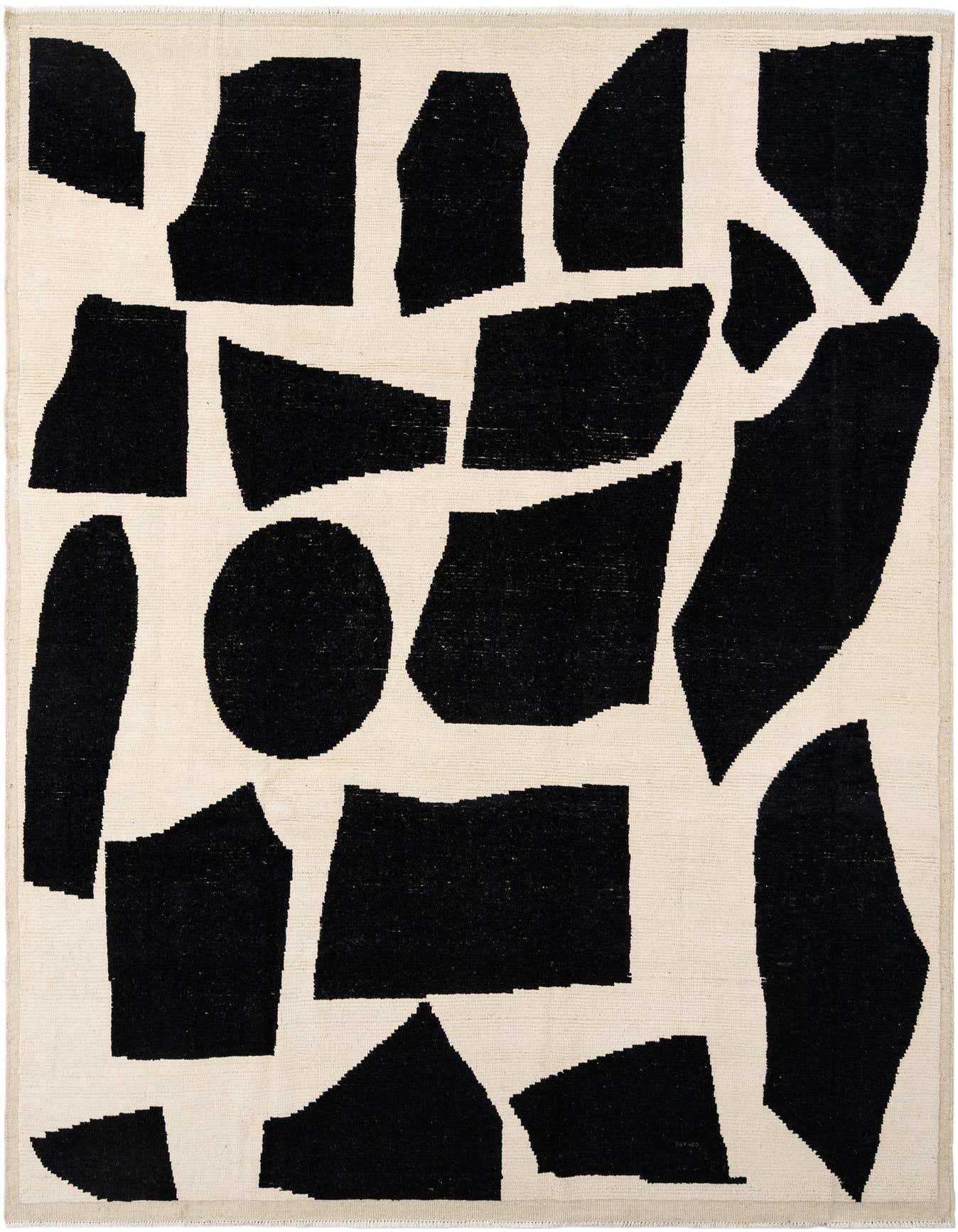 A rectangular Beni Marok rug with a bold, abstract pattern of black organic shapes on an ivory background.
