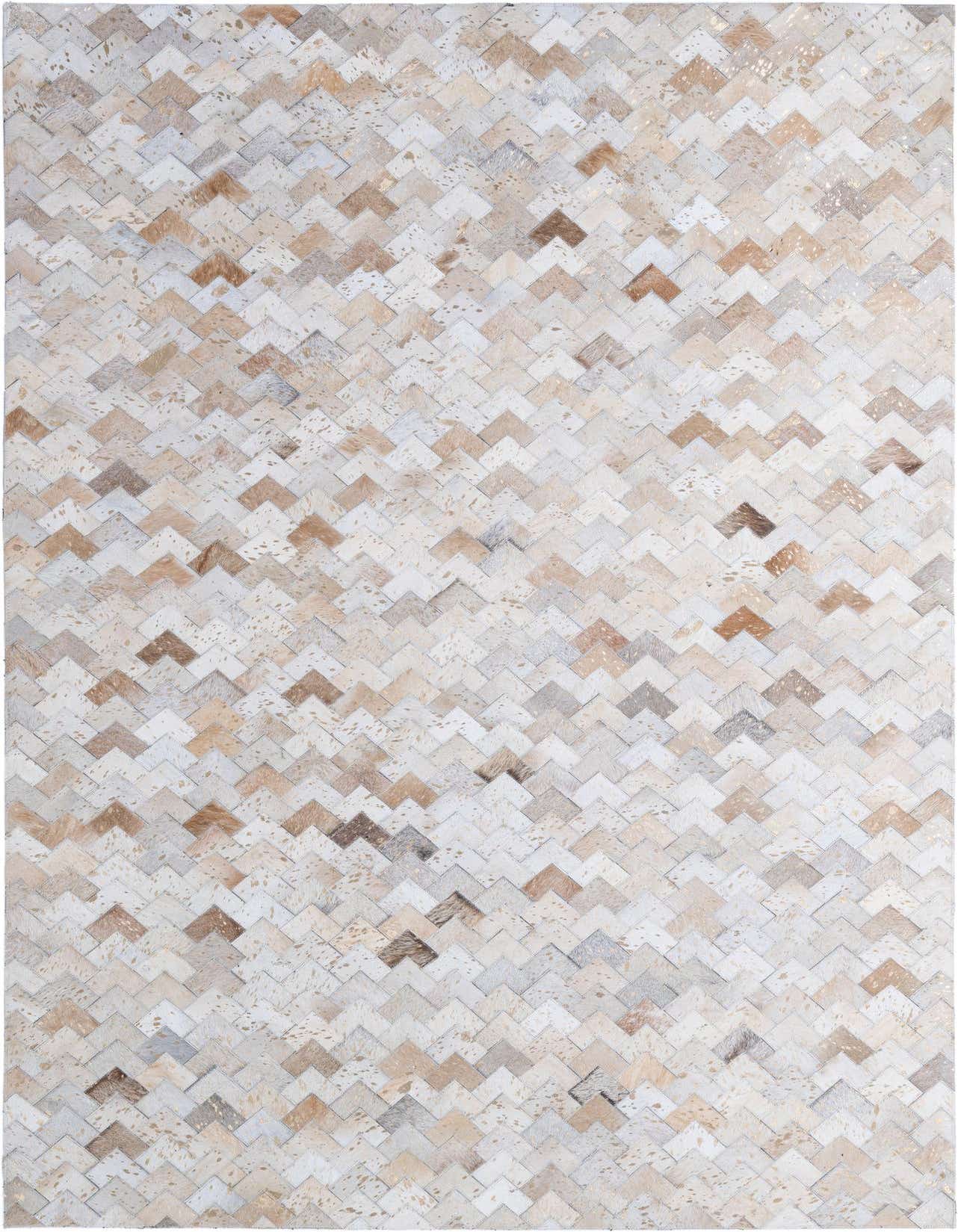 A 5x8 rectangular Cowhide Patchwork rug featuring a modern chevron pattern in various shades of ivory, cream, and light brown, suitable for a living room.