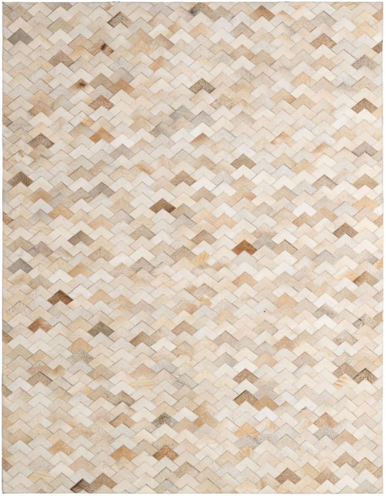 A 5x8 rectangular ivory and cream cowhide rug with a modern chevron patchwork pattern, suitable for a living room.