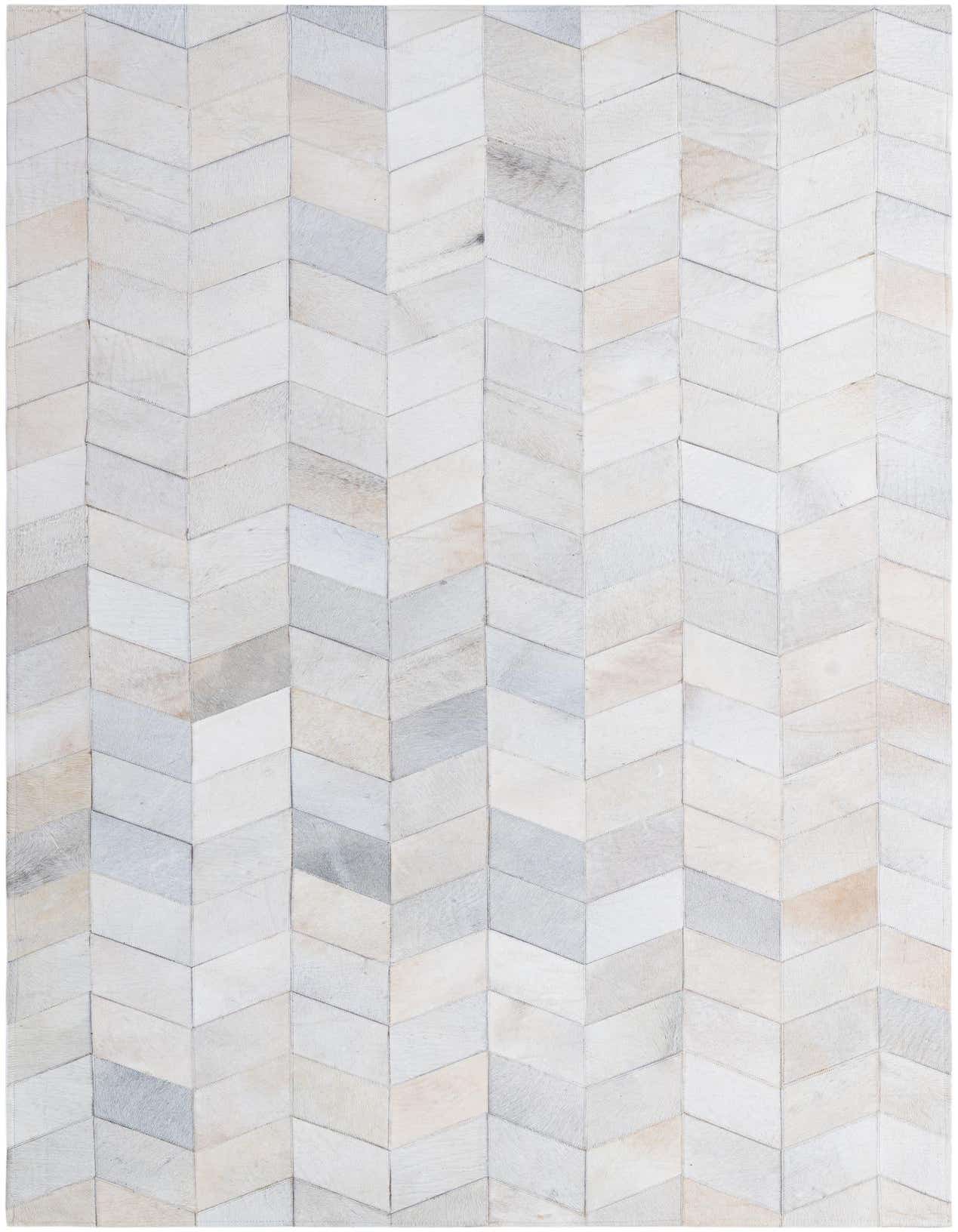 A rectangular 5x8 modern Cowhide - Patchwork rug featuring a chevron pattern in various shades of ivory and cream.