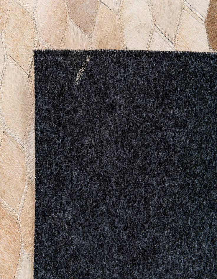 Detail image of  6' 7 x 9' 11 Cowhide Stocks Rug