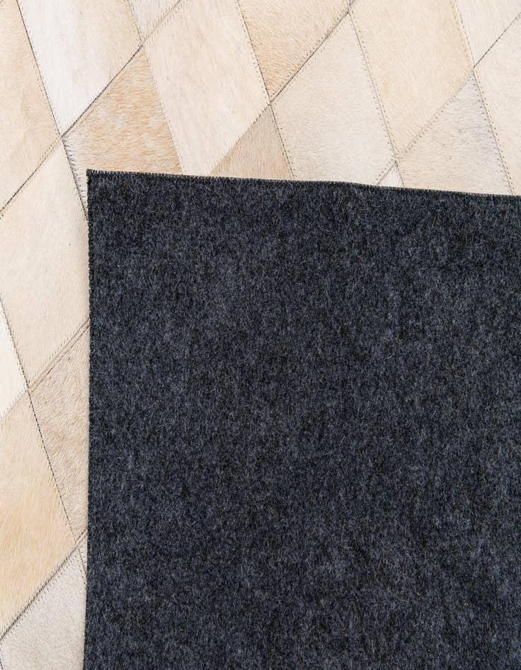 Detail image of  4' 11 x 7' 11 Cowhide Stocks Rug