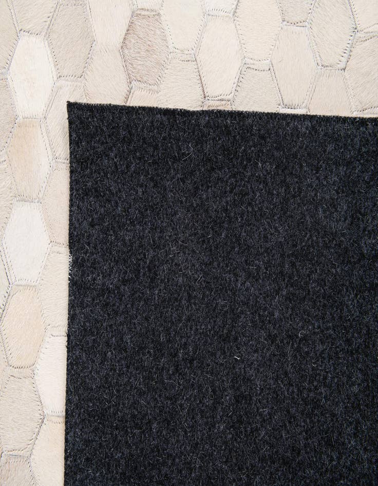 Detail image of  4' 11 x 7' 11 Cowhide Stocks Rug