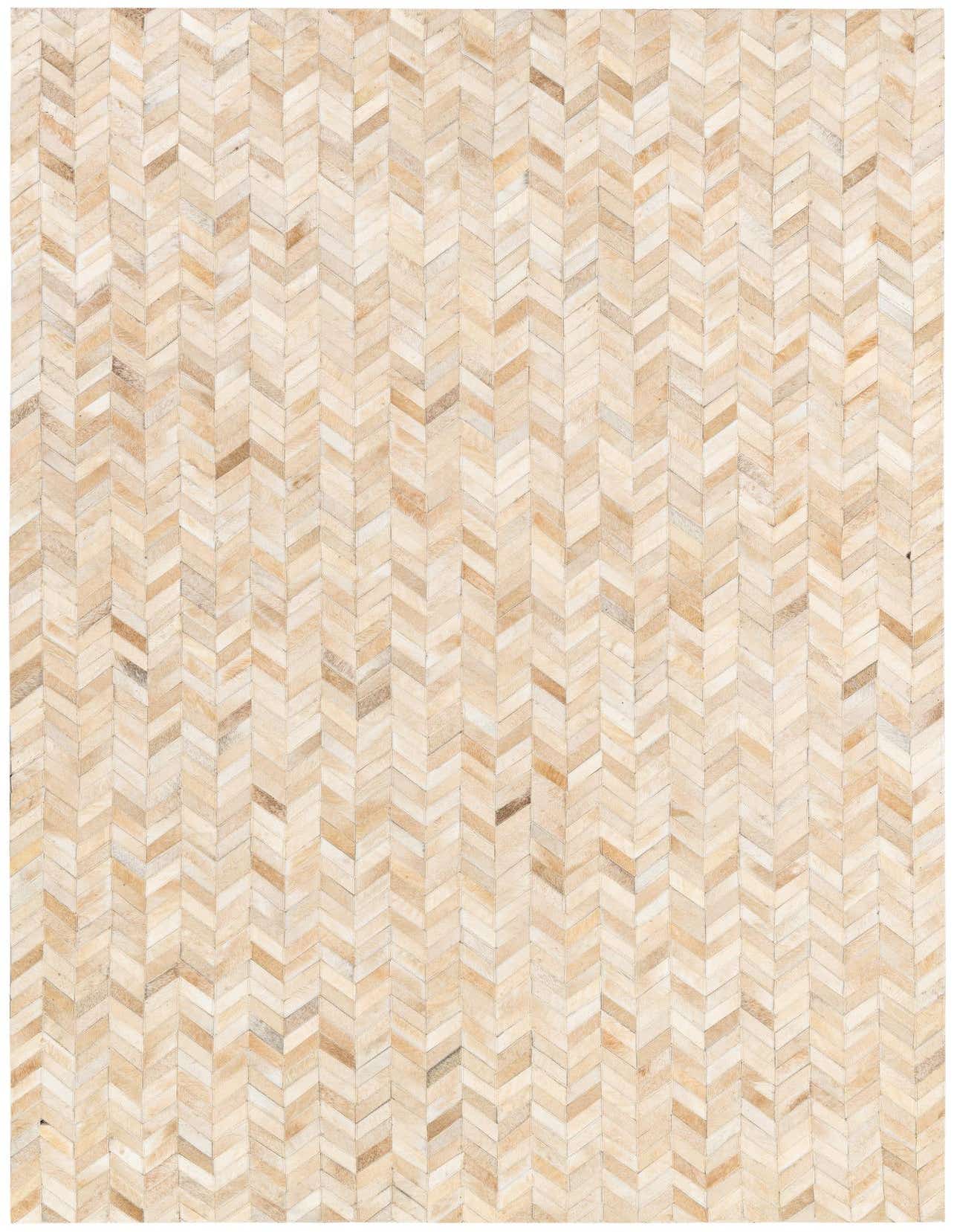 A 5x8 rectangular Cowhide Stocks rug from Rugs.com, featuring a modern chevron pattern in varied ivory and cream tones.