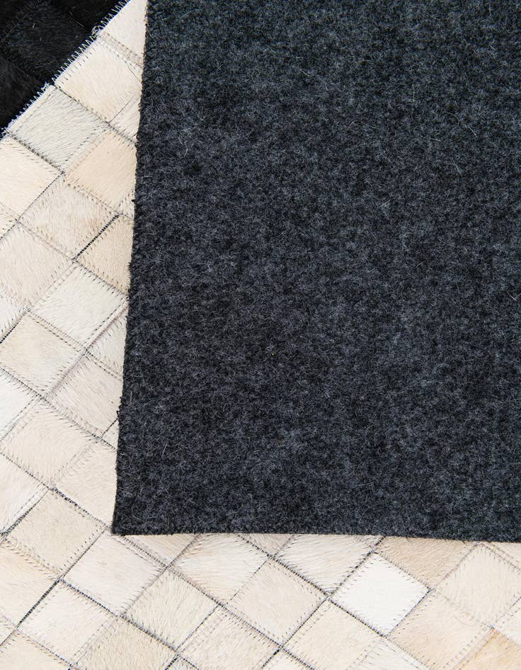 Detail image of  5' 1 x 8' Cowhide Stocks Rug