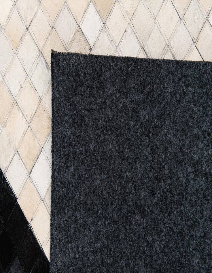 Detail image of  5' 2 x 8' 1 Cowhide Stocks Rug