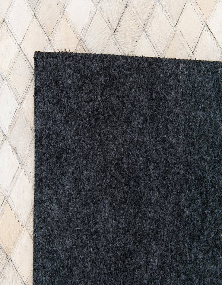 Detail image of  4' 11 x 8' Cowhide Stocks Rug
