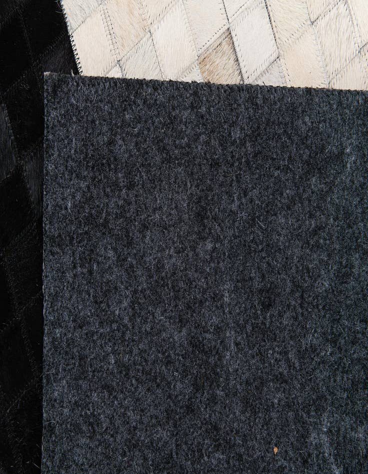 Detail image of  5' 1 x 7' 10 Cowhide Stocks Rug