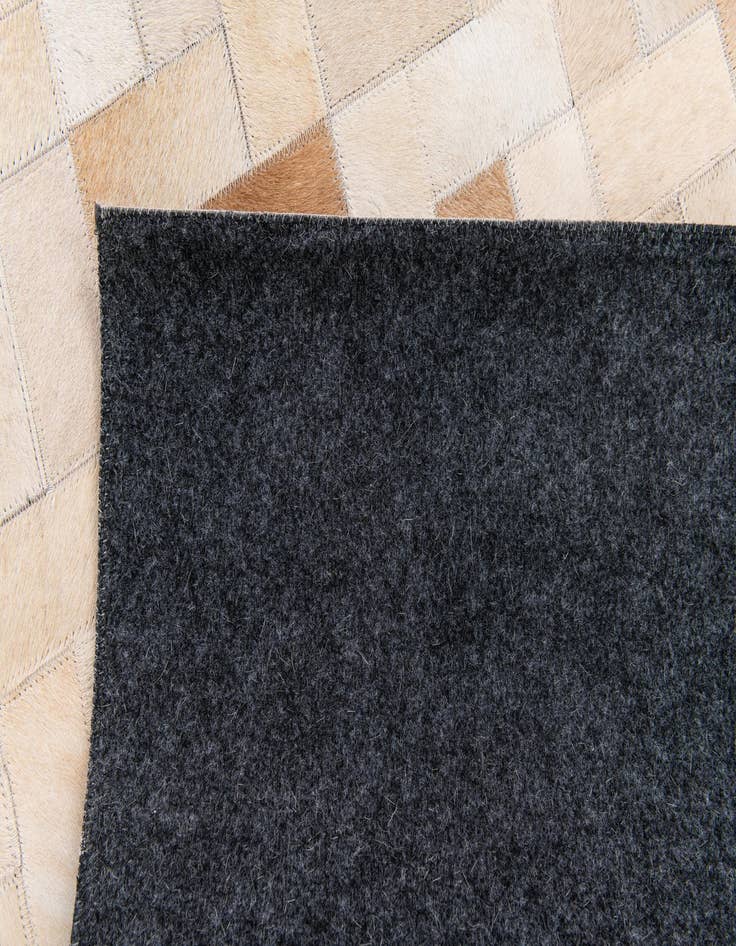 Detail image of  5' x 7' 11 Cowhide Stocks Rug