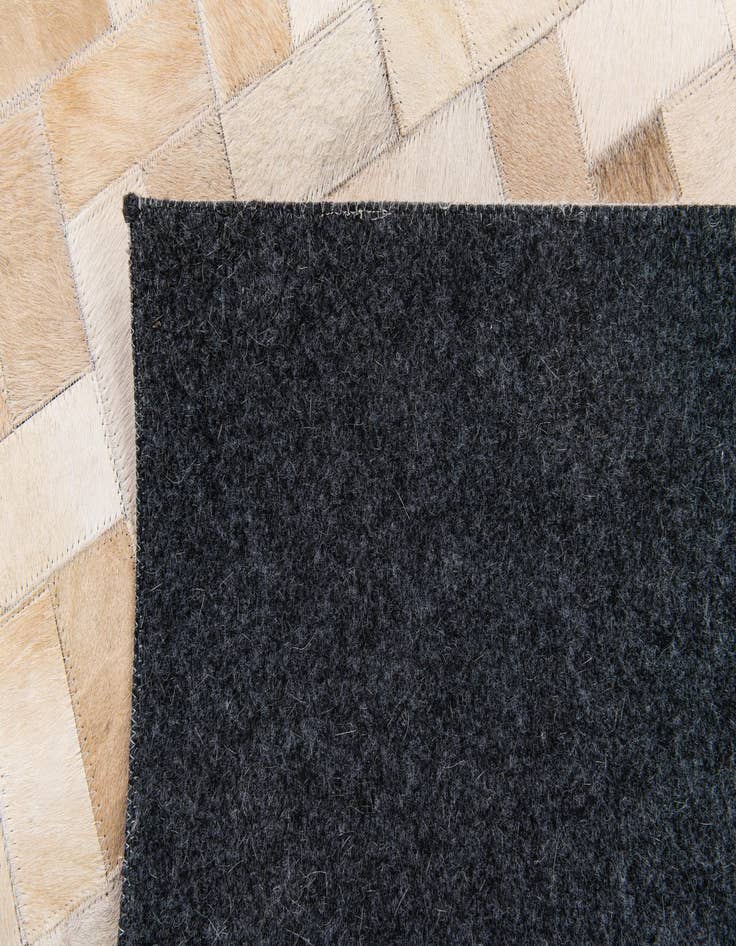 Detail image of  5' x 7' 11 Cowhide Stocks Rug
