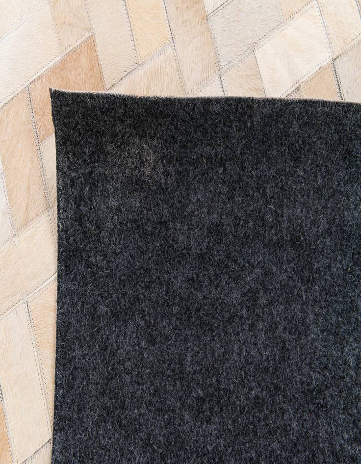 Detail image of  4' 11 x 7' 11 Cowhide Stocks Rug