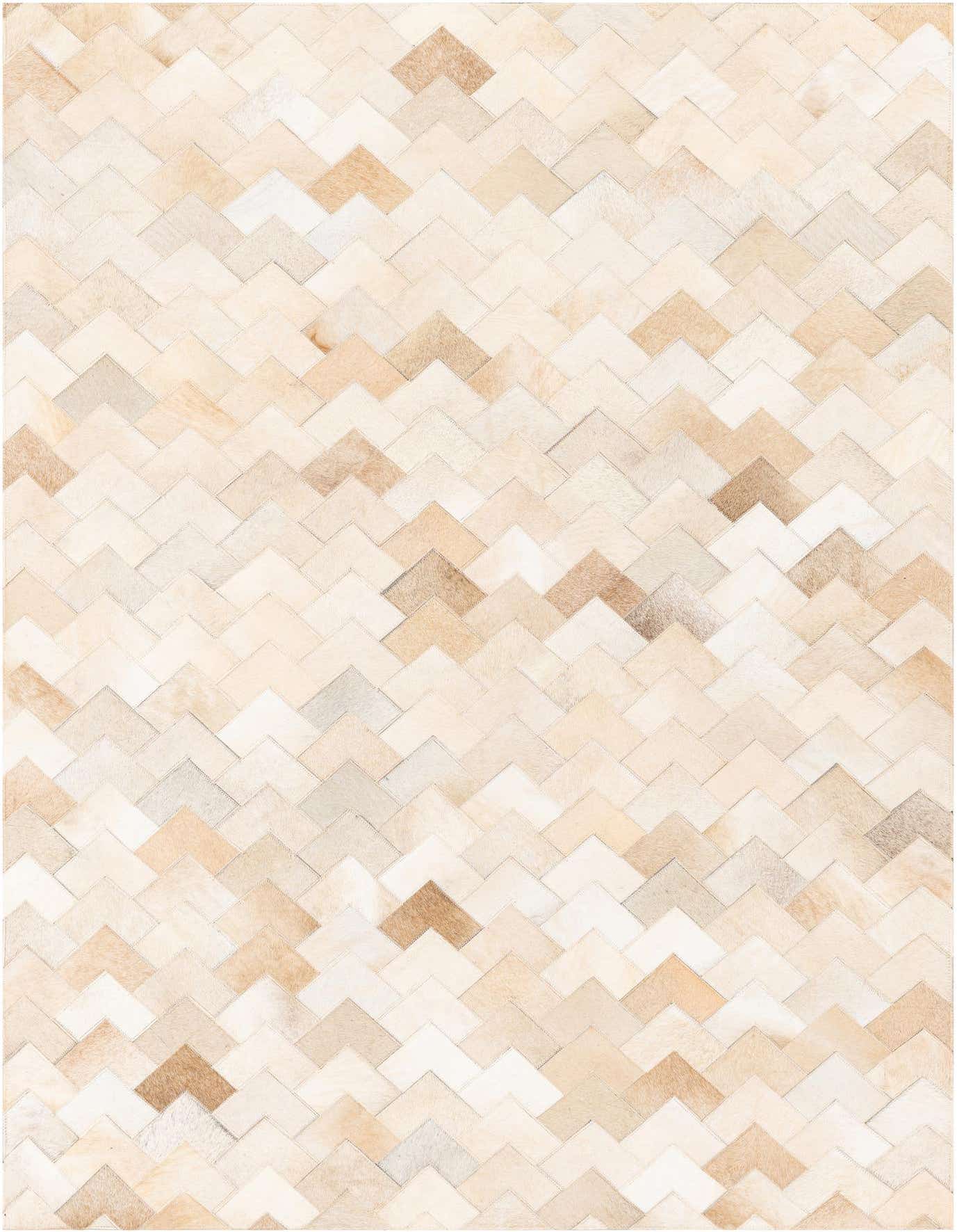 A 4x6 rectangular ivory cowhide rug with a modern chevron pattern, featuring varied cream and beige tones.