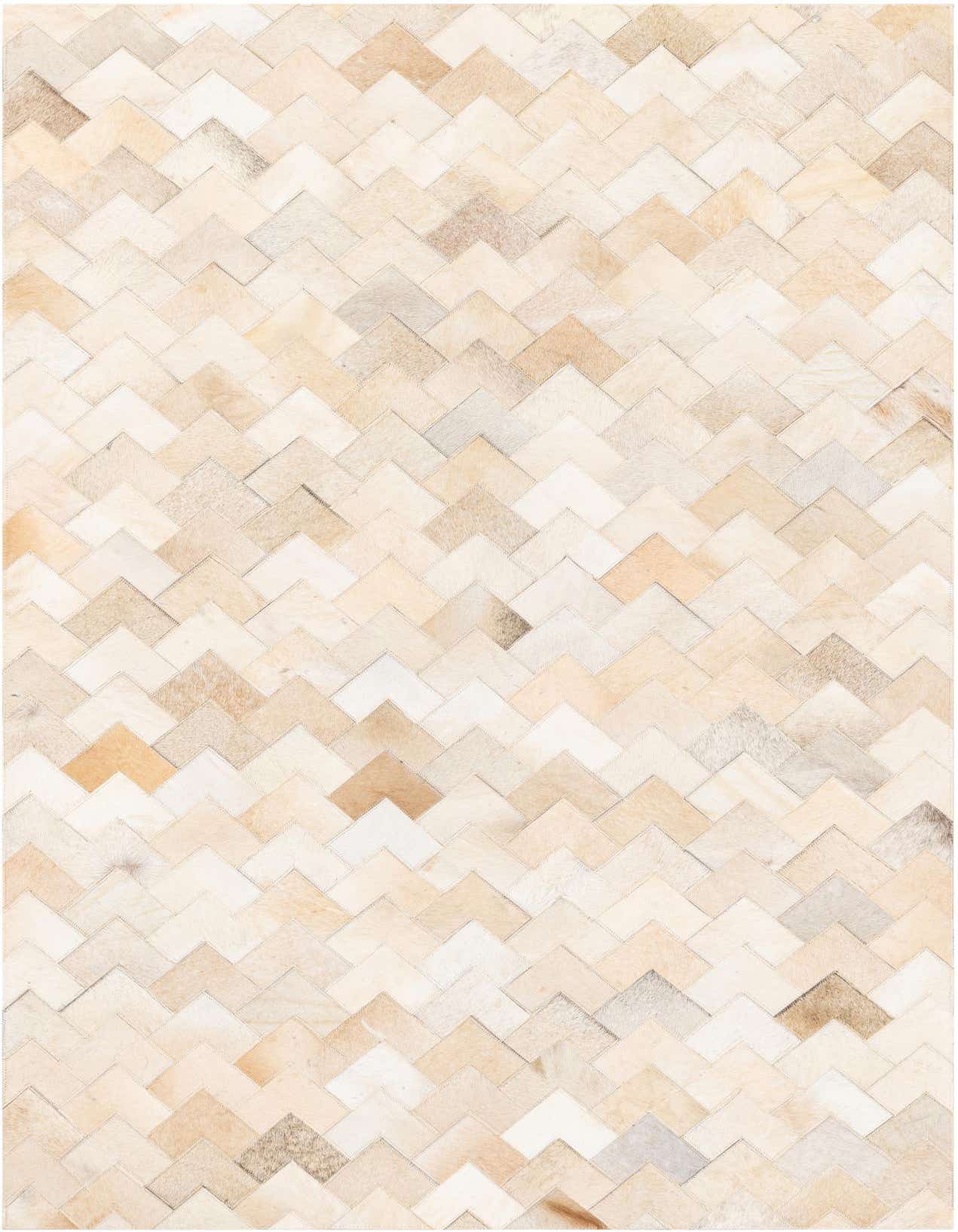 A rectangular 4x6 ivory and cream cowhide rug with a modern chevron pattern, perfect for a living room.