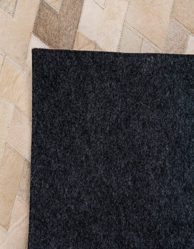 Detail image of  4' 2 x 5' 11 Cowhide Stocks Rug