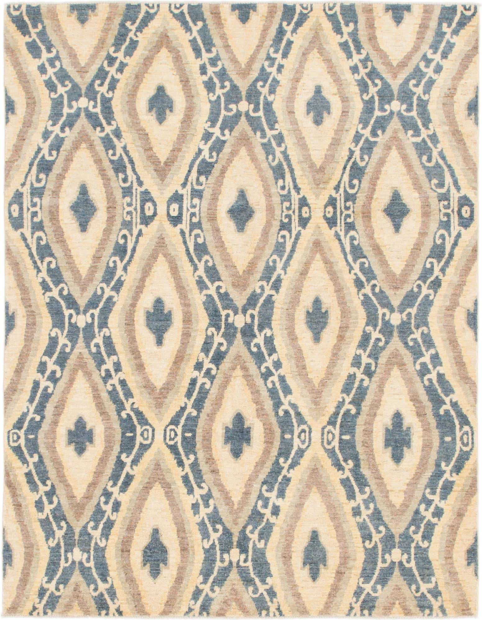A 4x6 rectangular ivory area rug with a tribal ikat pattern in shades of blue, brown, and cream.