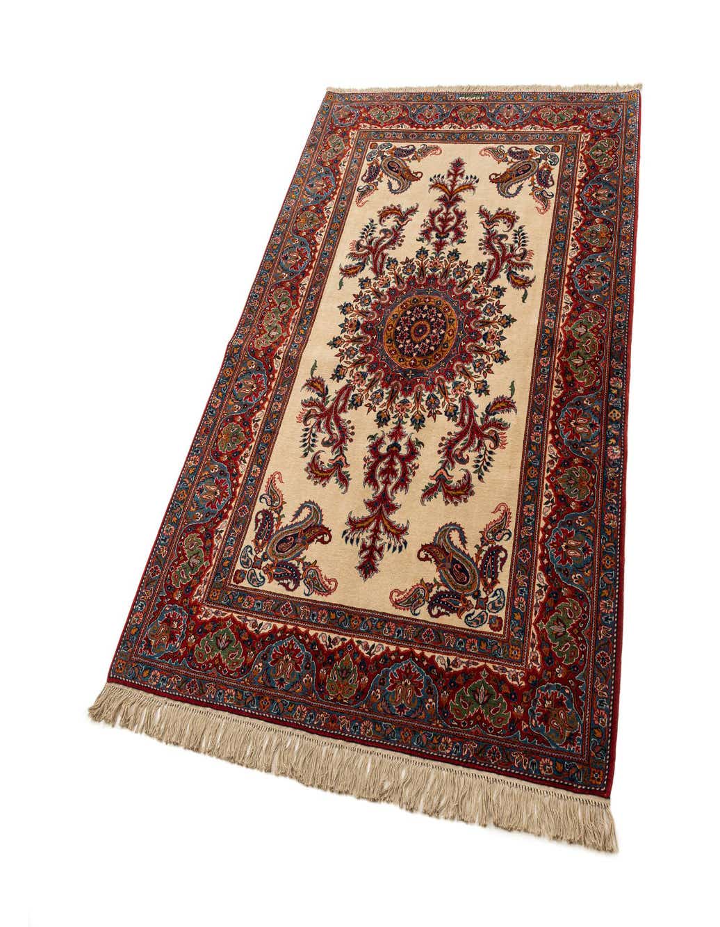 A 5x8 rectangular ivory area rug with a detailed traditional medallion and paisley border pattern in red, blue, and green.