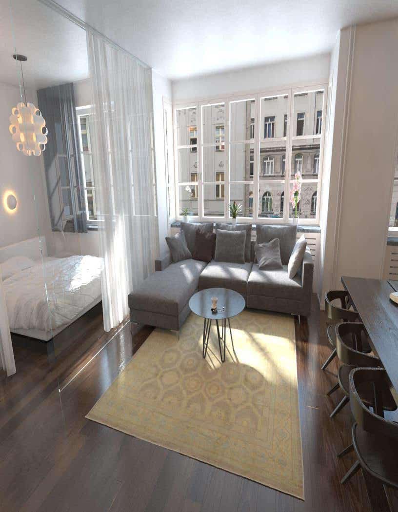 A 7x10 rectangular ivory Persian wool rug with a subtle geometric pattern under a gray sectional sofa in a bright living room.