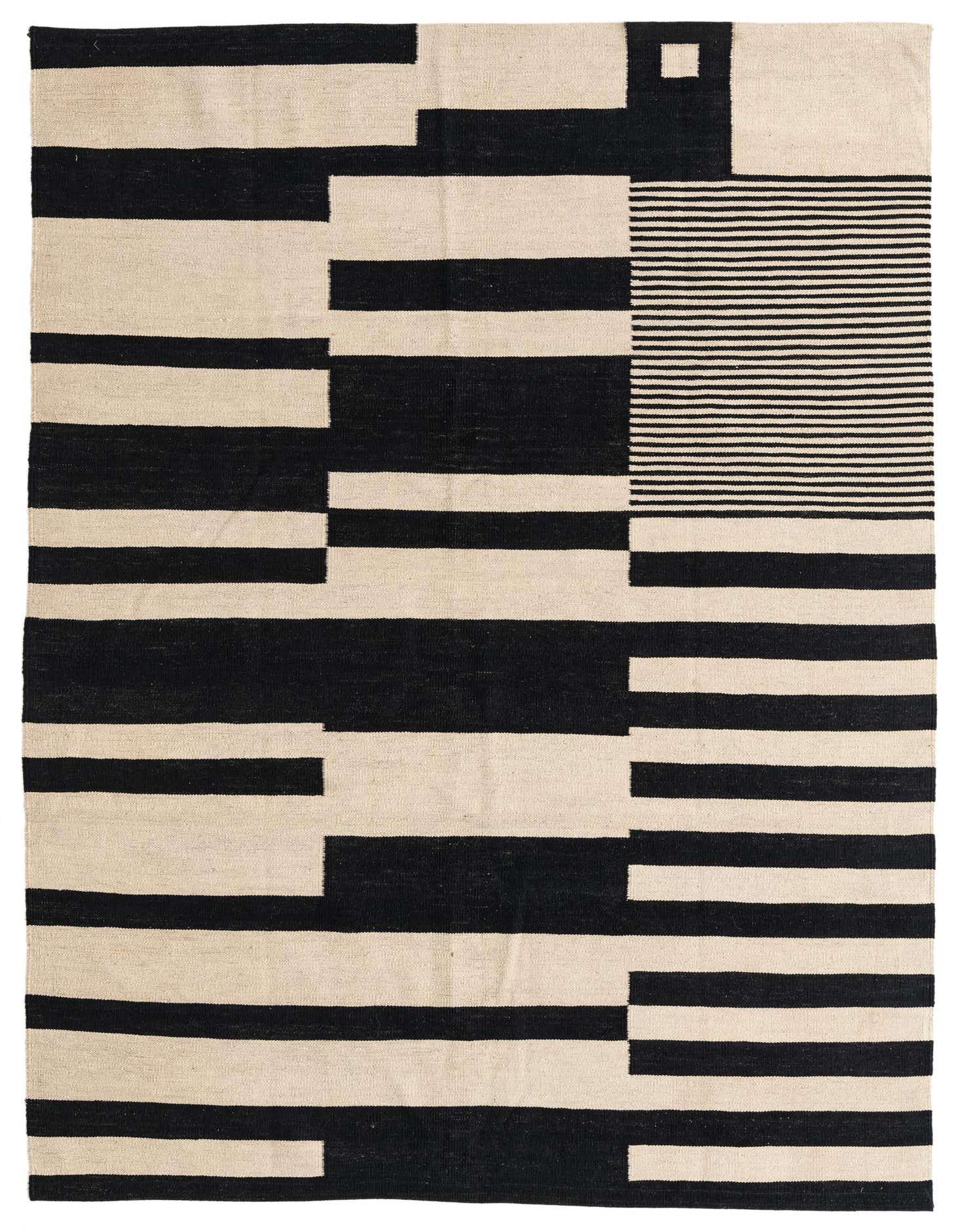 A 5x8 rectangular Kilim Modern rug with a bold abstract pattern of black and ivory stripes and blocks.