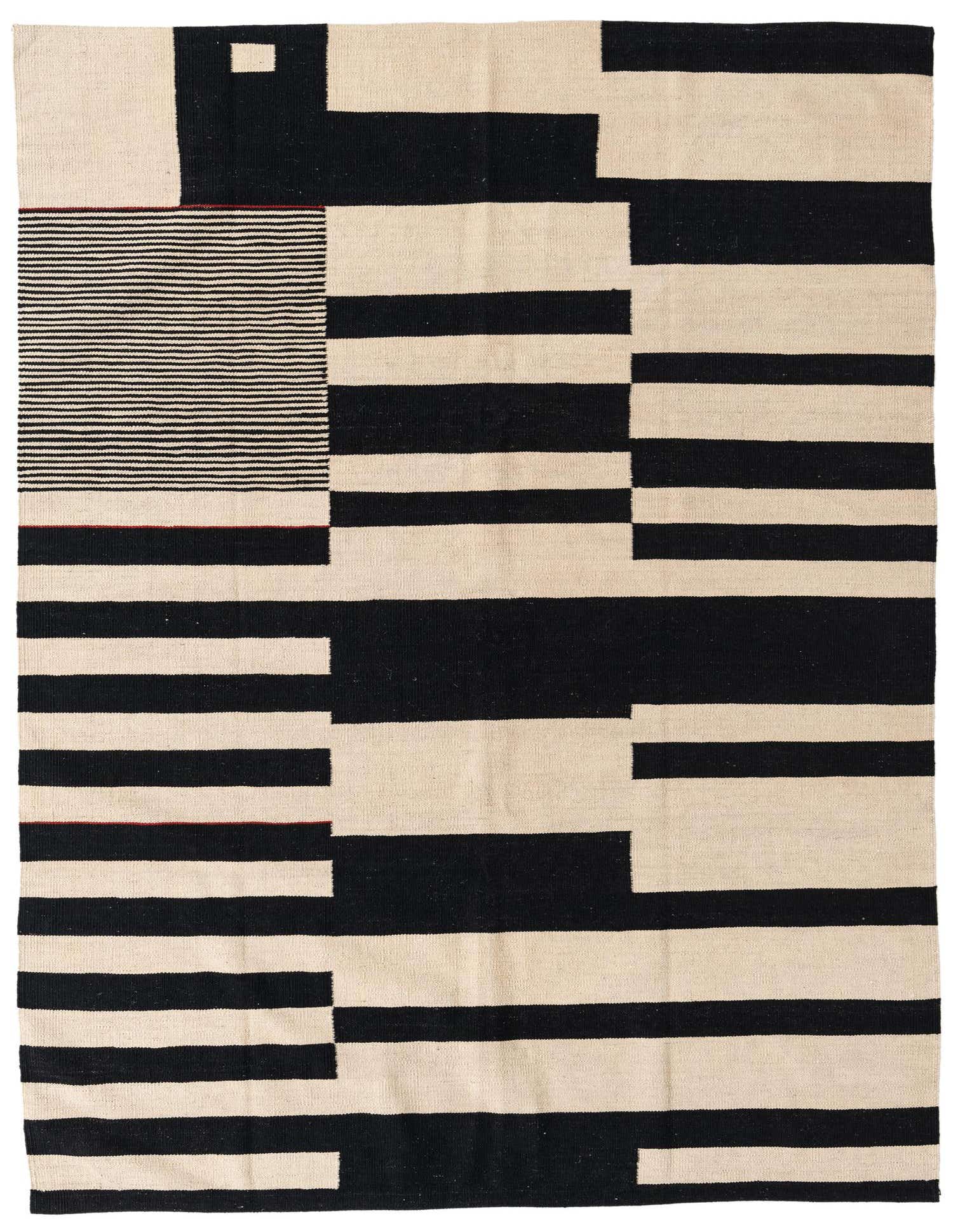 A 5x8 rectangular Kilim Modern rug with a bold abstract pattern of black and ivory blocks and stripes, handmade from wool.