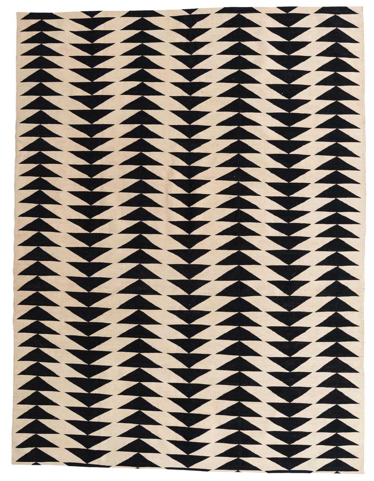 A 6x9 rectangular ivory and black flatweave rug with a repeating tribal triangle pattern, ideal for a living room.