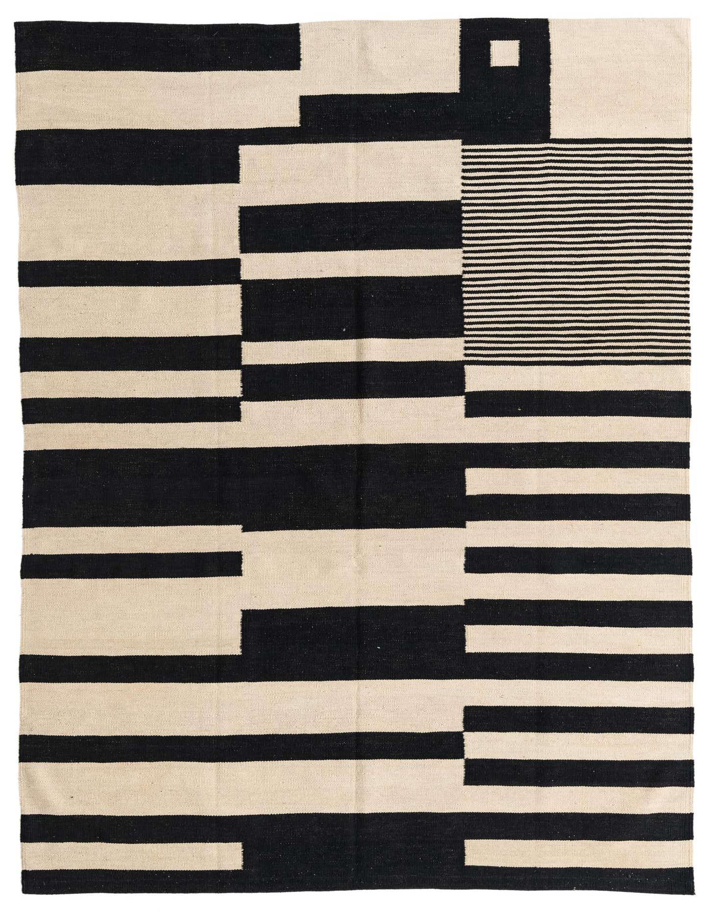 A 5x8 rectangular Kilim Modern rug with a bold abstract pattern of black and ivory stripes and blocks.
