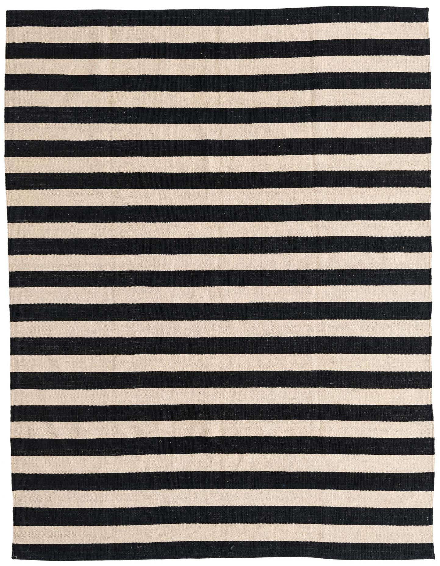 A 6x9 rectangular Kilim Modern rug with bold black and ivory stripes, handmade from 100% wool, perfect for a living room.