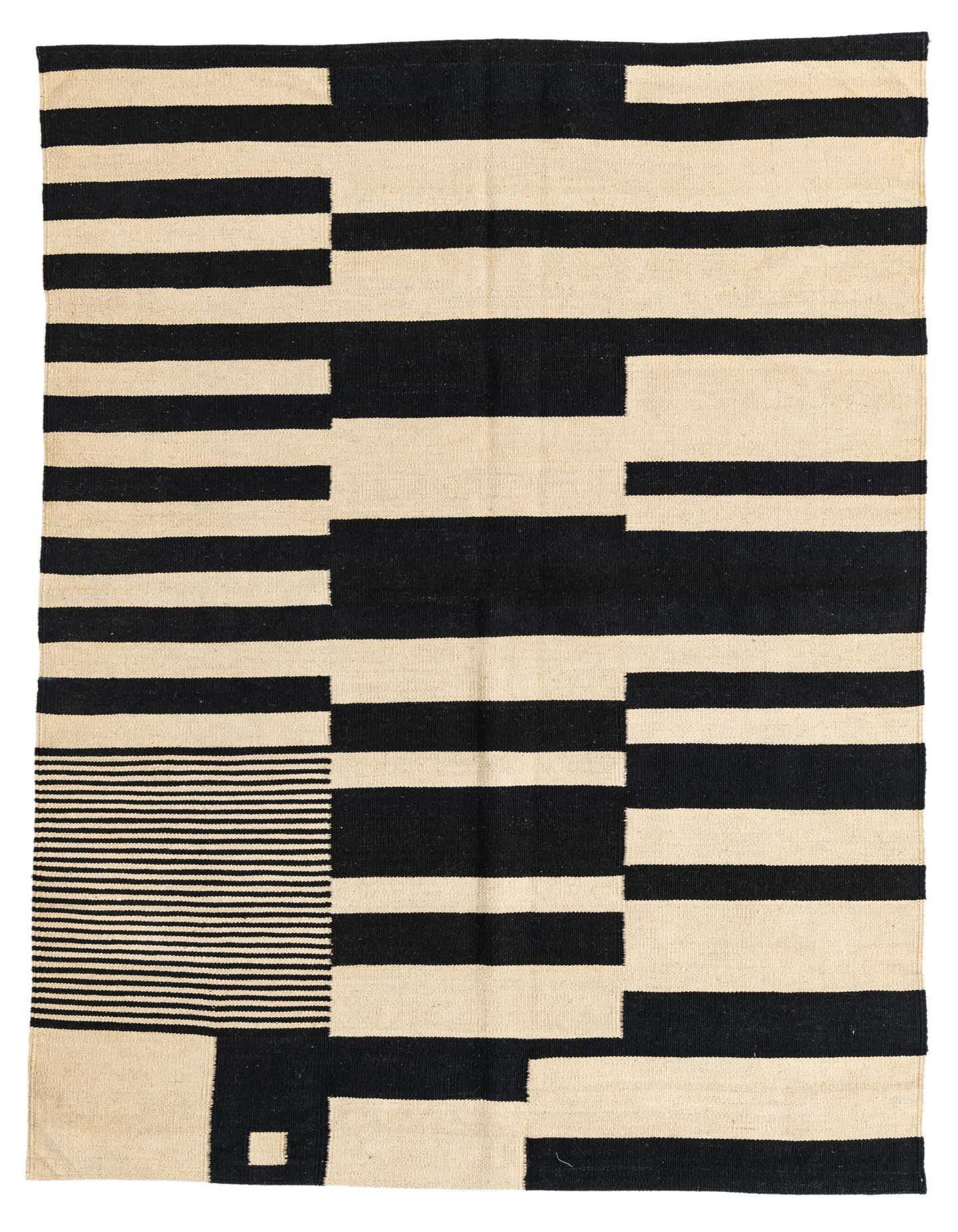 A 4x6 rectangular Kilim Modern rug with a bold black and ivory geometric tribal pattern, ideal for a living room.