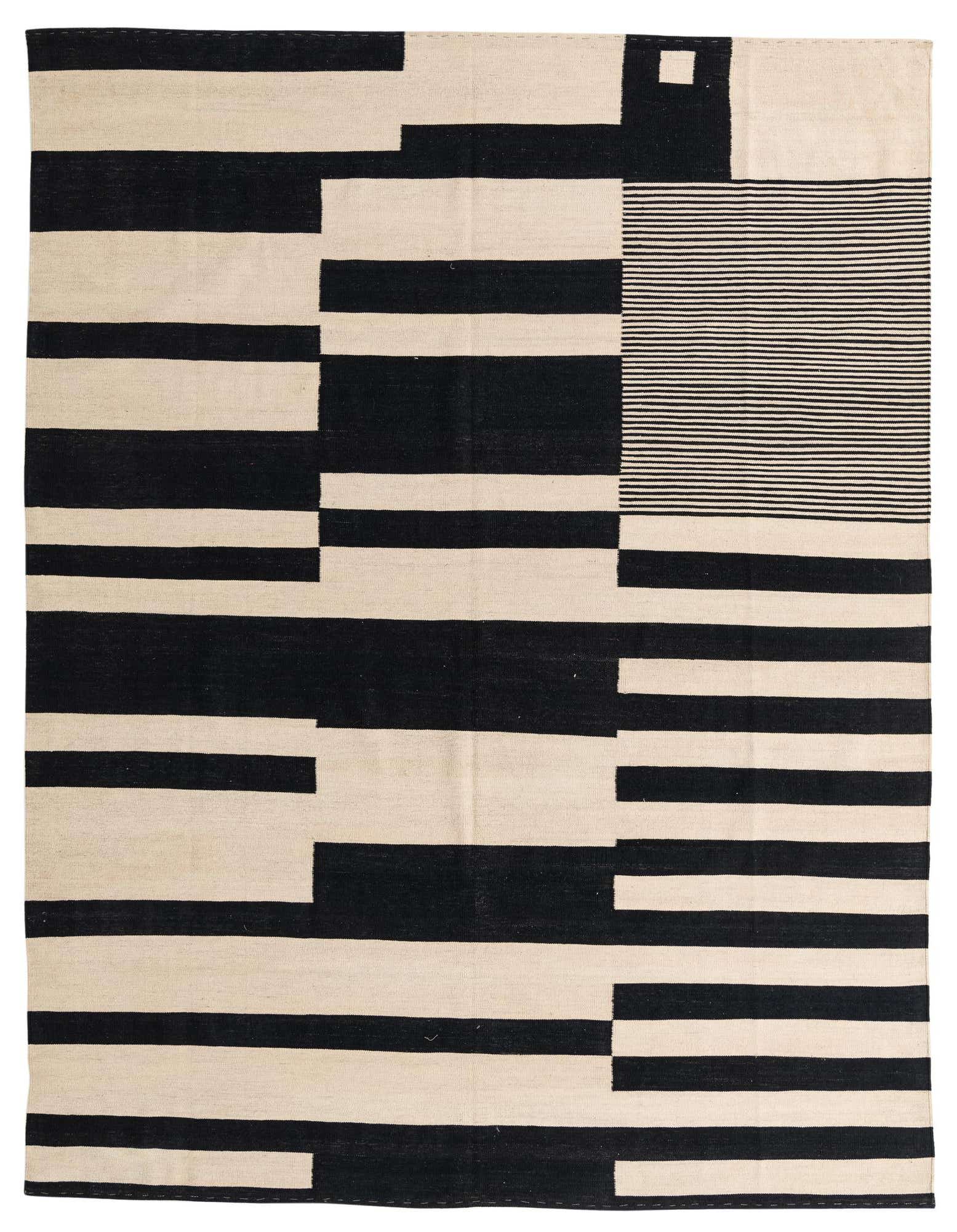 A large 8x11 rectangular Kilim Modern rug with a bold ivory and black abstract geometric pattern, perfect for a living room.