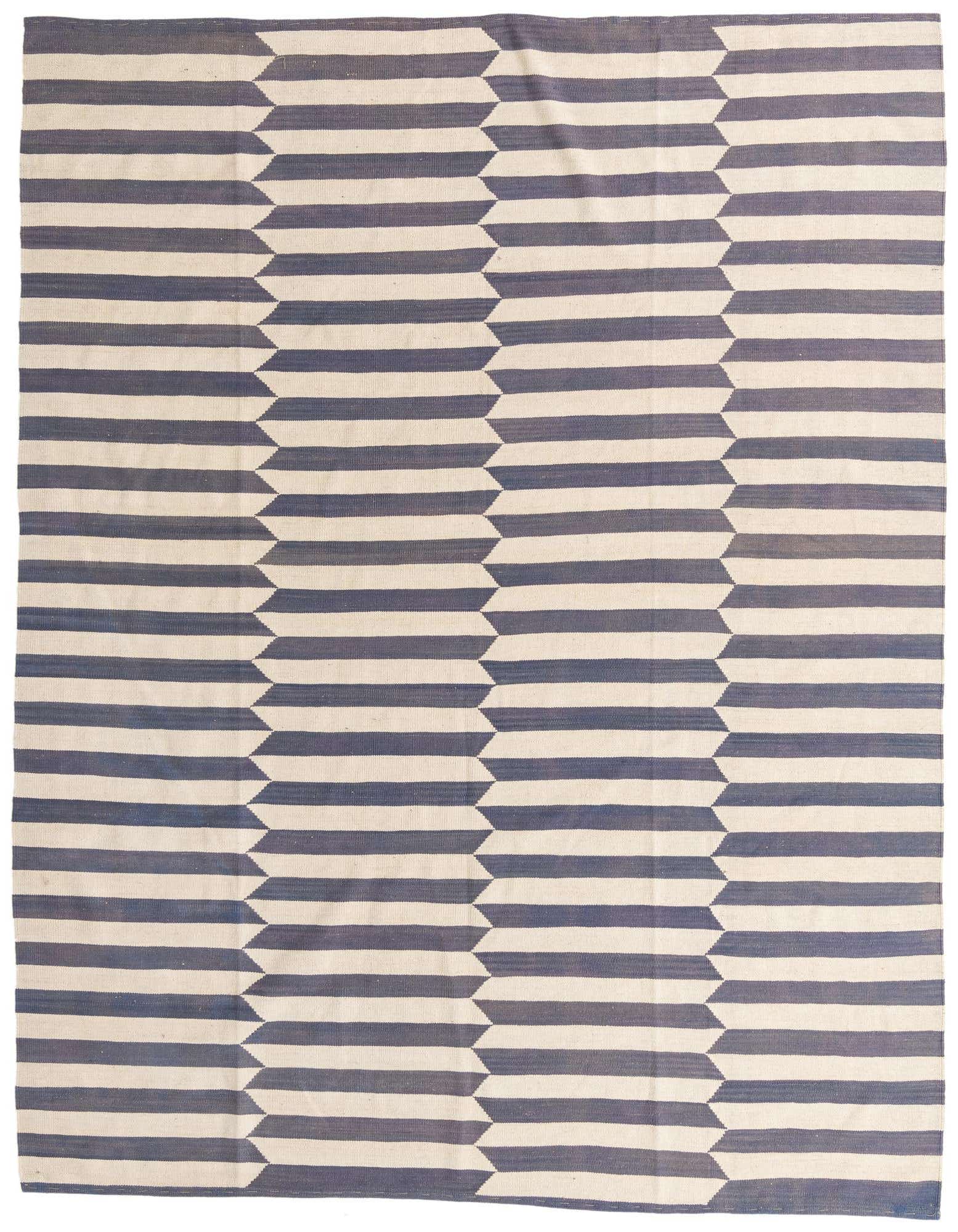 An 8x10 rectangular flatweave rug featuring a bold geometric pattern of repeating ivory and navy blue horizontal stripes with pointed ends.